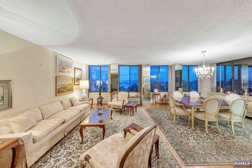 This coveted, corner 15/B line, offers a 'showstopper' Southern view of downtown Manhattan. As you enter, you are greeted by the magnificent view, through the four sets of double paneled windows. As if relishing in this surrounding, from sunrise to sunset, is not enough to please, the evening brings this view to another level of magical! It gets better! This corner unit offers sunset views, providing the both of best worlds! This backdrop is the perfect setting to update this two bedroom, two bath apartment to a stunning residence! Although, there is newer parquet flooring throughout the living room, dining room, and hallway. The B lines also offer an extra wide kitchen. Winston Towers is a 30 story, doorman building, set on the banks of the Hudson, with 24 hour security, outside & garage parking(additional), outside pool, tennis courts, basketball court, playground, party/meeting/recreation rooms, and buses to Manhattan, just steps away.