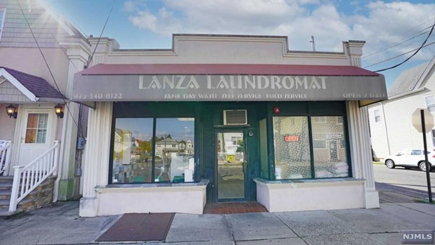 LOCATED ON A BUSY CORNER IN A RESIDENTIAL AREA OF GARFIELD WELL MAINTAINED MIX-USE BUILDING-2400 SQUARE FEET-ONE FLOOR.SALE INCLUDES THE PROPERTY WITH BUILDING WHICH HAS LAUNDROMAT $1450 RENT,1BEDROOM APT(RENT APPR-$1360M)LR,MEIK,1BD,FBTH,2BEDROOM APT(RENT APPR-$1375/M)LR,MEIK,2BED,FBTH PART BSMT W/2 FIN ROOMS&STORAGE.2 PARKING SPACES IN THE BACK. LAUNDROMAT HAS OFFICE,BATHROOM,UTILITY ROOM AND BASEMENT-SEPARATE UTILITIES,GAS,HOT WATER.BUILDING WAS REMODELED,ELECTRIC PANELS,PLUMBING,FURNACES,H/W HEATERS,ROOF.