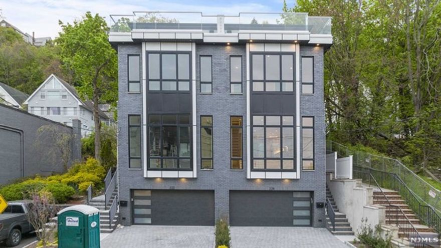 NEW CONSTRUCTION LUXURY DUPLEX. OVERSIZED LOT IN EDGEWATER NEW JERSEY WITH HUDSON RIVER VIEWS. APPROX. 4000 SQFT/ 4 LEVELS WITH PRIVATE ELEVATOR 10FT CEILINGS/ 4 BEDROOMS / 3 fULL 2 HALF BATHROOMS / AND MAGNIFICENT ROOFDECK. CONSTRUCTED WITH A MODERN CONTEMPORAY DESIGN THIS IMPRESSIVE DUPLEX HAS A CONTEMPORARY DESIGNED EXTERIOR DARK BRICK AND HARDIE SIDING WITH WALL OF GLASS. 2 CAR GARAGE ANDERSON WINDOWS THROUGHOUT. WRAP AROUND KITCHEN WITH PROFESSIONAL GRADE APPLIANCES AND 8 FOOT CENTER ISLAND. BEAUTIFUL LED LIGHTING CAN BE FOUND THROUGH OUT THE HOUSE, FLOOR TO CEILING TILE LINEAR FIREPLACE, DINING ROOM, POWDER ROOM AND OVERSIZED KITCHEN. 3RD FLOOR HAS PRIMARY BEDROOM AND BATHROOM, 2 ADDITIONAL BEDROOMS AND 1 BATH. TOP FLOOR HAS ENTERTAINMENT ROOM, WET BAR WITH ACCESS TO ROOF DECK AND 4TH BEDROOM AND FULL BATH