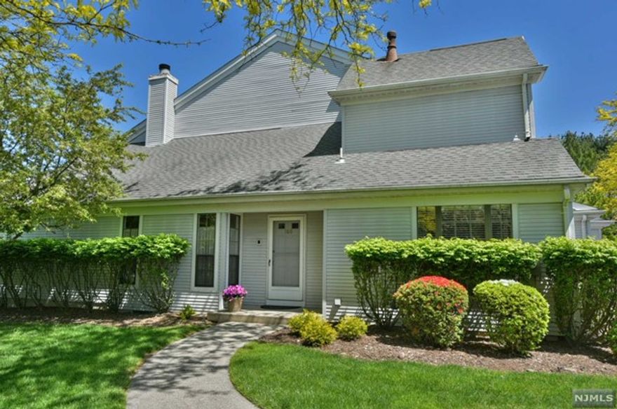 Elegance and warmth. This two-story townhouse located in desirable Chapel Greens has an outside deck offering a blend of modern living and outdoor leisure. Ideal for those seeking both gracious living and a touch of nature. Tucked into a quiet courtyard this community features spacious lawns while minutes to every amenity and convenience. Vaulted ceilings, recessed lighting and spectacular stone faced floor to ceiling fireplace anchor the main floor. Entertain easily stepping into a family room with wet bar that also opens onto the deck. Few units in Chapel Green have decks and this one is a beauty! An updated kitchen has loads of natural light, floor to ceiling custom pantry and center island along with table area. Linger on the second floor landing. Retreat to a primary suite with vaulted ceilings & private full bath featuring both shower and tub. Two additional bedrooms with ample closets and a full bath complete this floor. Also has full basement attach. garage & great storage