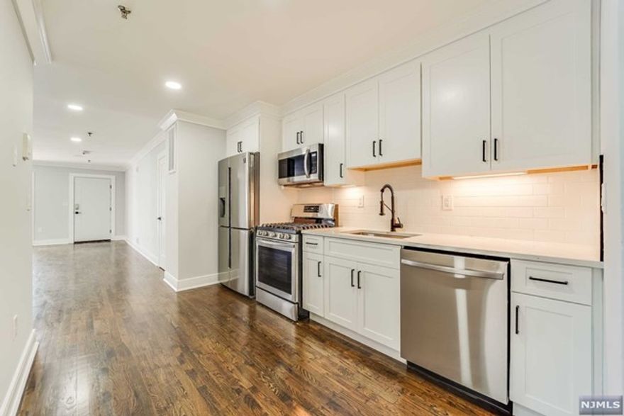 Welcome to Union City! Stunningly renovated 3bdrm 2bath 1,256 sf new condominium is completely upgraded for your needs. Walk into your spacious, bright and open living/dining room featuring recessed lighting leading into your private terrace making it an amazing entertaining space. New kitchen boasts shaker style white cabs with tons of storage, Calacatta quartz countertops and stainless steel appliances including, 4 door fridge, microwave and gas range. Master bath is featured in the master bedroom. Hardwood floors throughout. Enjoy additional outdoor space with a shared yard and deeded garage parking. Very accessible location, close to shopping, dining, schools, houses of worship and easy access into NY Port Authority, Lincoln Tunnel, all major highways. Come see this before its gone. Seller pays 1st yr of taxes. VIRTUAL TOUR: https://my.matterport.com/show/?m=8bCQu9fcjeW