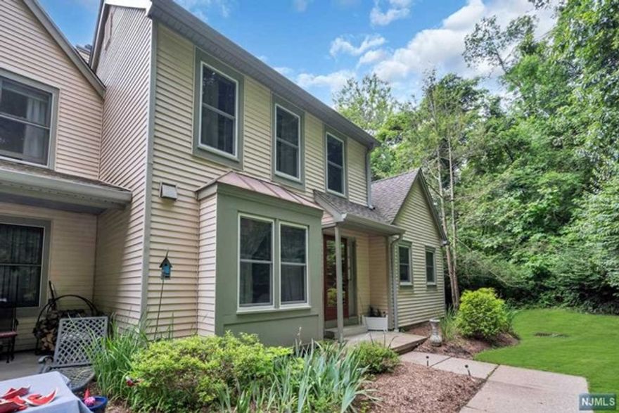 Welcome home to this well maintained, updated and spacious 3-level, end-unit townhome located within the desirable gated community of Panther Valley. The home's inviting interior offers an open floor concept that features hardwood floors and vaulted ceilings which welcomes vast amounts of natural light. The ground floor offers a large family room with access to covered patio, utility/laundry room and interior access to the two-car garage. The oversized main floor yields a powder-room, eat-in-kitchen with S/S appliances and granite countertops, formal dining area, living room with fireplace and direct access to a private elevated deck, a master bedrooom with on-suite bathroom and walk-in-closet. The home's two additional bedrooms and bathroom can be found on the second level. The home's location and community offers private security, 3 pools, tennis/pickle/basketball courts, playgrounds, walking path, and 6.6 miles to Hackettstown train station for NYC transportation.