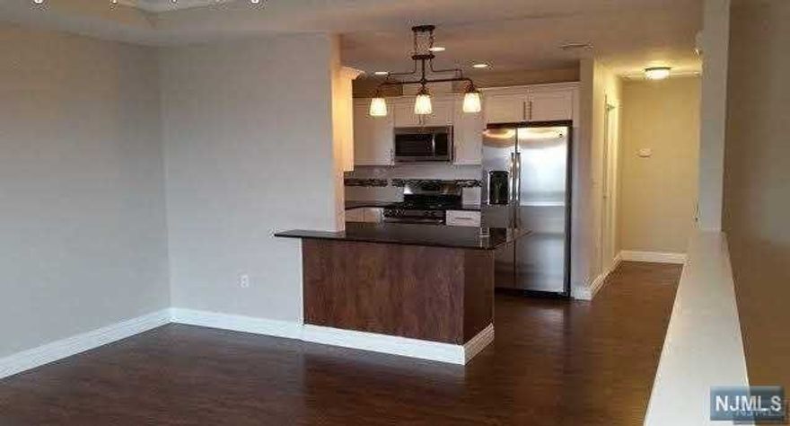 Beautifully renovated 2 bedroom 2 full bathroom unit in 2 family building between 11th St. and Bergen Blvd in Palisades Park. Beautiful renovated kitchen with granite counter tops and stainless appliances. Gorgeous new bathrooms with tile and stone throughout. Master bedroom features large walk in closet. Also comes with access to 1 garage parking space, and 1 driveway parking space. Washer and Dryer in Unit