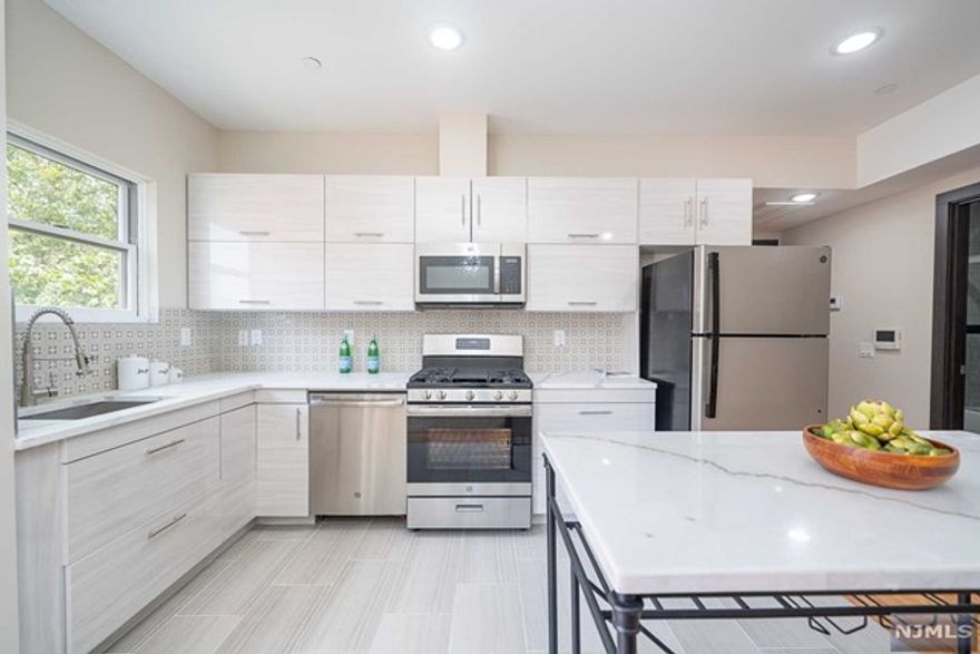 NEW CONSTRUCTION! Buy now before prices sky rocket like they did in JC Heights! Welcome to 65 Storms, a boutique-style building with attractive amenities located in the heart of the McGinley Square neighborhood of Jersey City. These luxury homes feature a brick & vinyl facade complemented by modern, elegant interiors creating an upscale experience in the heart of McGinley Square. A collection of 9 modern homes that are a must see. Featuring open floor plans, stunning hardwood floors throughout, sleek custom cabinetry, central air, Quartz countertops,stainless steel appliances,recessed lighting & remarkable bathrooms with textured bath tiles & chrome channels. Our homes all include either outdoor terraces or Juliet balconies. Elevator access, secured entry, a shared backyard & a gorgeous common rooftop w/ NYC views are sure to please even the most discerning buyer. Eligible for 5-year tax abatement. HOA prepaid for first 2 months