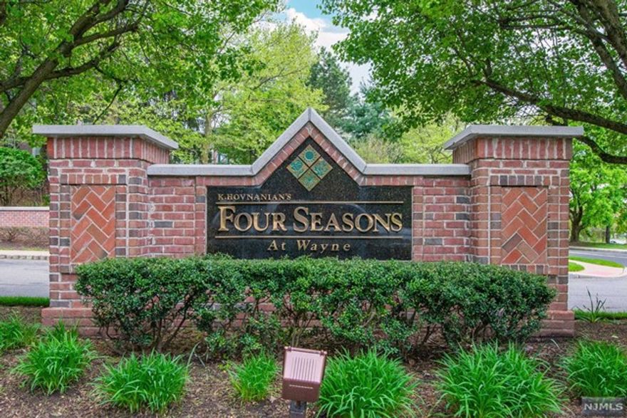 Welcome to the 55+ community of Four Seasons in Wayne! This Cherry Model END unit is an exceptional find, offering 2 bedrooms and 2 full bathrooms. The large master bedroom boasts 2 closets, including a walk-in closet and a private bathroom. The second bedroom also features a spacious closet. The open floor concept is perfect for entertaining guests, and the high ceilings and neutral decor create a bright and airy atmosphere. Enjoy new flooring throughout the unit, sliders to a private covered patio as well as ample additional parking and two covered assigned garage spaces. A private storage unit is also included for your convenience. Residents of Four Seasons have access to a range of amenities, including a clubhouse with a kitchenette and gym, a card room, an in-ground pool, a library, and tennis courts. Don't miss this opportunity to experience a comfortable and active lifestyle!