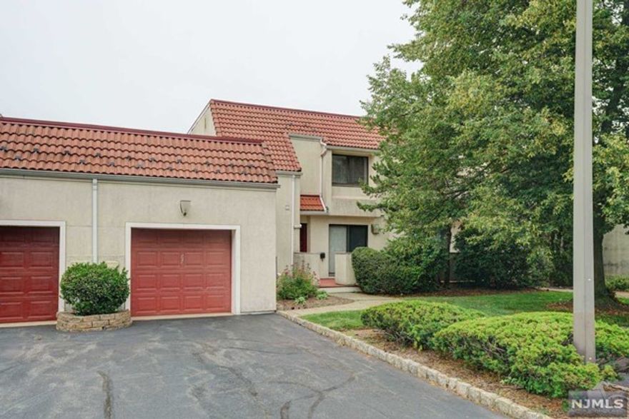 Mother-daughter house. 4 bedrooms, 2 eat-in kitchens, 3.5 baths, 1 den, one-car garage, 2-car driveway, add'l guest parking. Living+dining+famil y rooms, eat-in kitchen, half bath, washer/dryer on 1st floor. 3 bedrooms, two baths on 2nd floor. Complete basement with living/dining, 1 bedroom, 1 den, open kitchen and bathroom. Access to backyard from basement.Gated community. Great security. Commute bus to the city at gate. HOA includes water, gated security, all maintenance outside of the house (including regular pest control, gutter cleaning, roof power-washing) and the use of the clubhouse. Clubhouse has a fully equipped gym, outdoor, kiddie and indoor heated pools, sauna, playground, library, lounge, and multipurpose rooms. Pickleball, tennis and basketball courts are lit for evening play. Management arranges yoga, water aerobics, art and craft classes and seminars exclusively for community residents.Right at 280 exit 8A. ShopRite, Starbucks, dine-in AMC, and restaurants.
