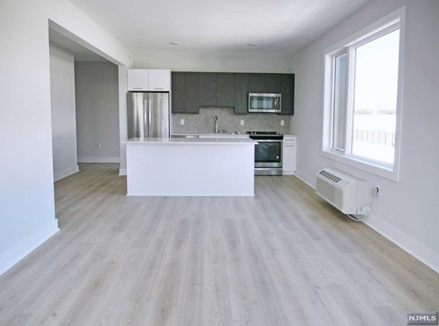 Welcome to Sylvan Ridge - This unit provides amazing city and GWB skyline views. Sylvan Ridge features modern units with spacious floorplans & high end finishes. Some highlights include: beautiful modern kitchens w/ stainless steel Energy Star appliances, full kitchen island land, wood floors, shades on all windows, large washer and dryer in each unit, master baths with large walk-in showers and many units with views of the GWB & Manhattan skyline! One parking spot included in the rent; 2nd space: $100/month. Spacious lounge area with a beautiful fireplace, TV, couches, free Wi-Fi, fitness center & outdoor terrace (included in rent). Steps away from the GWB and all major highways. Within blocks to all Fort Lee has to offer including brand new stores, restaurants & movie theatre. Tenant responsible for electric.