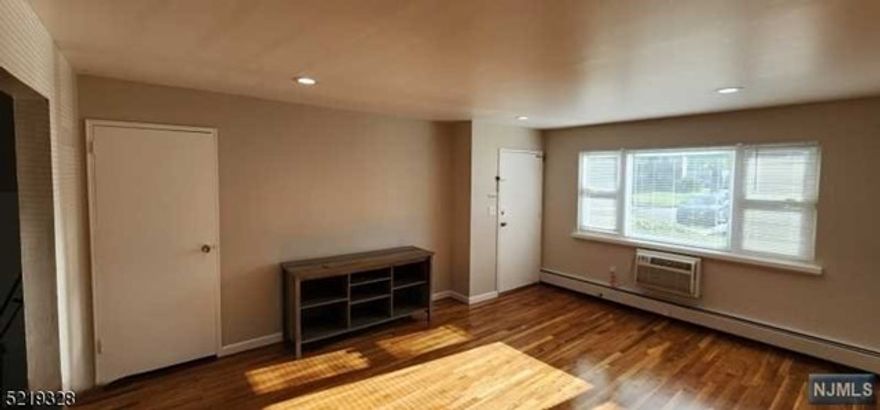 This spacious first floor two bedroom condo features a large living room with a huge storage closet, dining room with a second entrance to the back and it's one assigned parking spot. A beautiful kitchen with plenty of top and bottom cabinets allowing for plenty of storage. Quartz counter tops and a breakfast bar, refrigerator, dishwasher & microwave. Completely renovated bathroom. Freshly finished hardwood floors throughout. This unit also features lots of closet space in both bedrooms. There is also plenty of parking on the cul-de-sac. The nearest laundry is steps out of the back door. A beautiful inground community pool also awaits. Walking distance to NYC bus. Shopping is nearby, trader Joe's, Whole Foods, Restaurants, Schools & more.