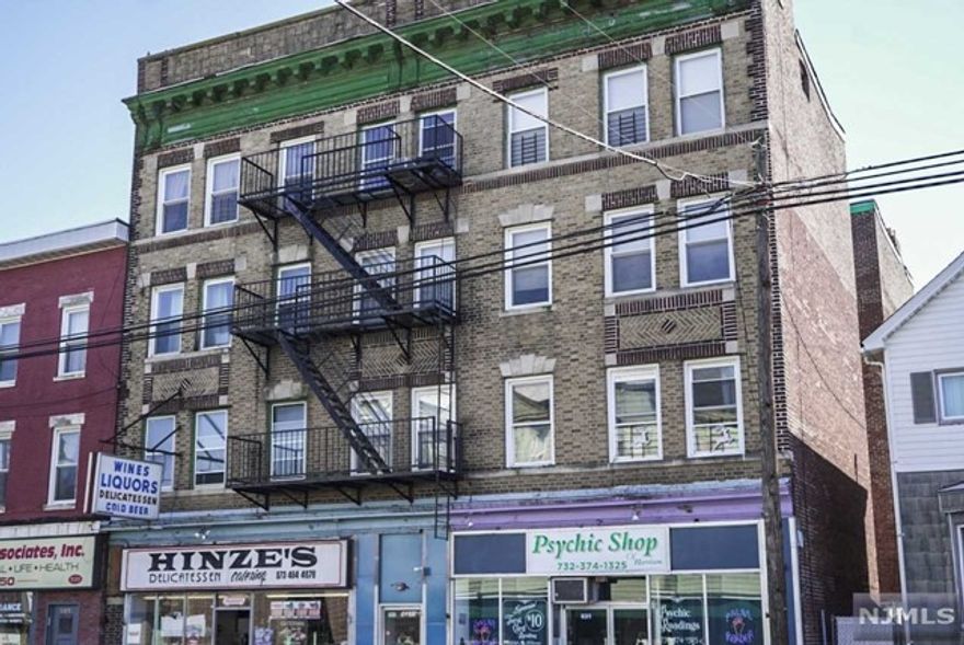 Investment property in the heart of Harrison. 1031 Exchange approved. Two retail stores on main level and 13 apartments above-fully occupied. No elevator. Close to shopping, transportation and houses of worship. Qualified buyers only please. Excellent addition to your portfolio.