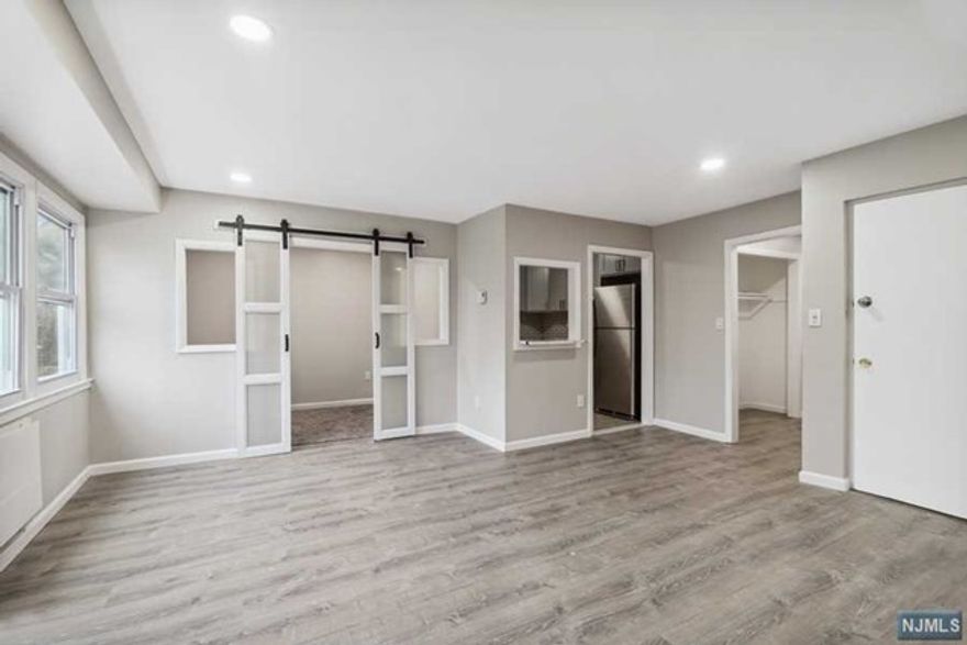 Newly renovated 2 Bedroom, 2 Bath & a Den/office rental in the heart of East Orange, NJ! This spacious & modern apartment has brand new floors and freshly painted walls. The open concept living and dining area are perfect for entertaining or just relaxing after a long day. The kitchen boasts new stainless steel appliances, quartz countertops, and plenty of cabinet space. Both bedrooms are generously sized and feature large closets with plenty of storage. The primary bedroom has an on-suite. Both full bathrooms have been completely updated with new fixtures, tiles, and vanities. This rental also includes laundry on site, 1 Garage parking spot, and 1 outdoor parking spot. Rental also has access to fenced backyard. Located in the heart of East Orange, this apartment is just steps away from restaurants, shops, and public transportation. You'll be just a short commute to NYC or anywhere in NJ.Don't miss your chance to make this newly renovated 2 bedroom, 2 bath rental your new home!