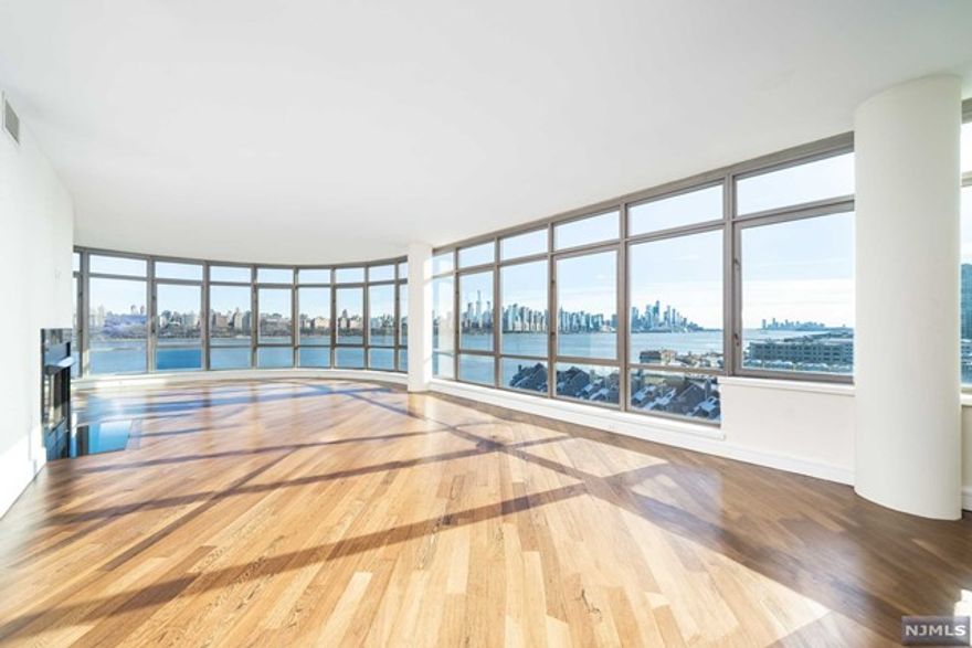 Incomparable panoramic NYC and Hudson River Views! This truly one of a kind south facing home features 4 bedrooms plus den, 4 bathrooms and over 3,200s/f of living space. Features of this home include a fully equipped kitchen with granite counters, oak cabinets and a SubZero and Miele appliance package, gas fireplace, high ceilings and floor to ceiling windows offering sweeping views of the entire Manhattan Skyline down to the Verrazano Bridge. Bedrooms are generous in size, offer custom closets, en-suite bathrooms and enjoy direct NYC and Hudson Views. Master suite is complete with walk-in closet and en-suite bathroom with steam shower and Jacuzzi tub. Private elevator access to home with formal entry Foyer. The Watermark offers world class amenities including 2 pools, fitness center, concierge and so much more! 2 car garage parking AND massive southeast facing roof deck included!