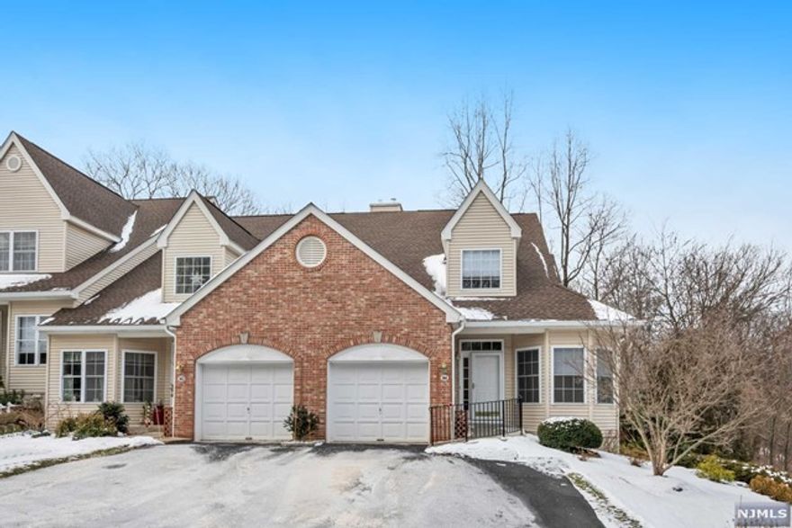 Beautiful sun drenched townhouse in active 55+ community. Spacious, open floor plan, remote-control blinds, gas fireplace, deck off of the living room overlooking a wooded backyard. Main floor master bedroom w/ en suite. Chair lift to the second floor which boasts a bedroom, loft/family room, full bath and tons of storage including a cedar closet.This unit also has a full, unfinished walk out basement. Convenient guest parking across the street and the clubhouse is nearby.