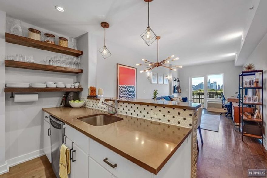 Love the building, but looking for an updated unit? We got you! Owners spent about 40k in renovation about a year ago. Best value in the building. This one bedroom apartment features a den that could be used as an office or guest room, plus a full and a half bathrooms. It comes with stainless steel appliances (fridge, gas range, microwave and dishwasher), new washer and dryer in unit, two new HVAC's, plus a walk-in closet en-suite. They also added a chandelier, recessed lighting with dimmable bulbs and controlled by Wi-Fi; new water heater; shelves in the kitchen, bedroom, closet, and storage room. From its private balcony, enjoy breathtaking views of the NYC skyline and sunrises. This apt includes garage parking, one of the most spacious one. Come live in the most prestigious building of Union City! In addition, the build has an approved renovation of the lobby and hallways, without any assessment. The commute to NYC is unbeatable. Owner is a Realtor. A must see!