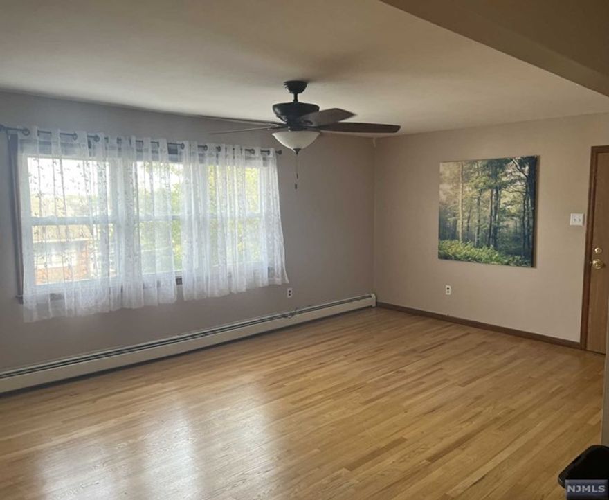 Spacious and updated second floor apartment for rent in a 2-family house. Large living room, dining room, and kitchen. 3 bedrooms and 2 full baths total - there is a master bedroom with a full bath. Hardwood floors throughout the living spaces. Rental includes water, as well as one reserved parking spot in the driveway. There is street parking available with town permit. Washer/dryer not included.