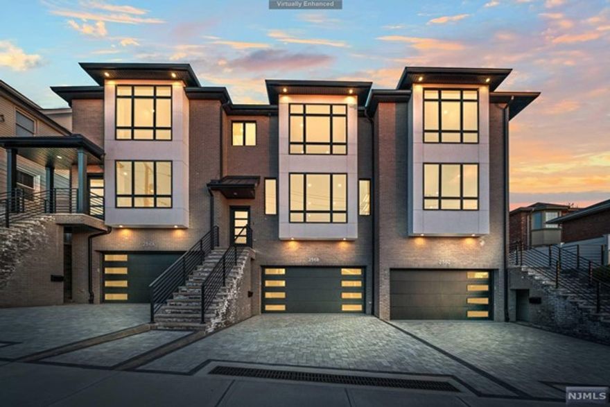 Welcome to 256 7th St, 3 brand new townhouse units that epitomize modern luxury. Oversized windows provide a sun-filled open space full of custom finishes. Some features include a fireplace with built-in shelves, red oak select hardwood floors, GE Cafe appliances and quartz waterfall countertops. Step into the yard through a sliding door to enjoy a paver patio, complete with custom lighting, a turf area and putting green! Upstairs the master suite offers three closets, a private bath with heated floors and a freestanding tub. Two additional bedrooms round out this space and there is a convenient laundry room on the same level. The ground level features a garage, finished recreation room with a half bath and an extra room. Nothing to do but move in!