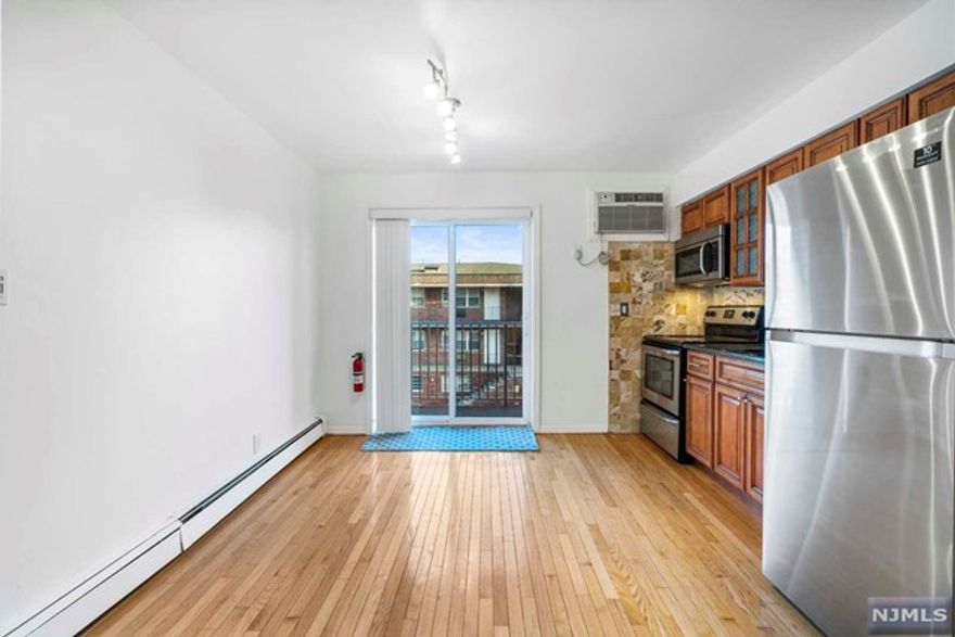 BRIGHT AND SPACIOUS 1 BR CONDO (APPROX 715 SQ FT.) IN GREAT LOCATION AT PALISADES PARK. HW FLOORS THROUGHOUT, UPDATED KITCHEN WITH MAHOGANY CABINETS, GRANITE COUNTERTOPS, NEW STAINLESS STEEL APPLIANCES AND NEW ENTRANCE DOOR. HEAT, HOT WATER AND WATER INCLUDED IN THE MAINTENANCE. * CLOSE TO SHOPPING/RESTAURANTS & NYC TRANS! LARGE EAST FACING TERRACE OFF FROM THE LR & MODERN KIT. THIS CONDO INCLUDES ONE DEEDED INDOOR GARAGE SPACE (#6)