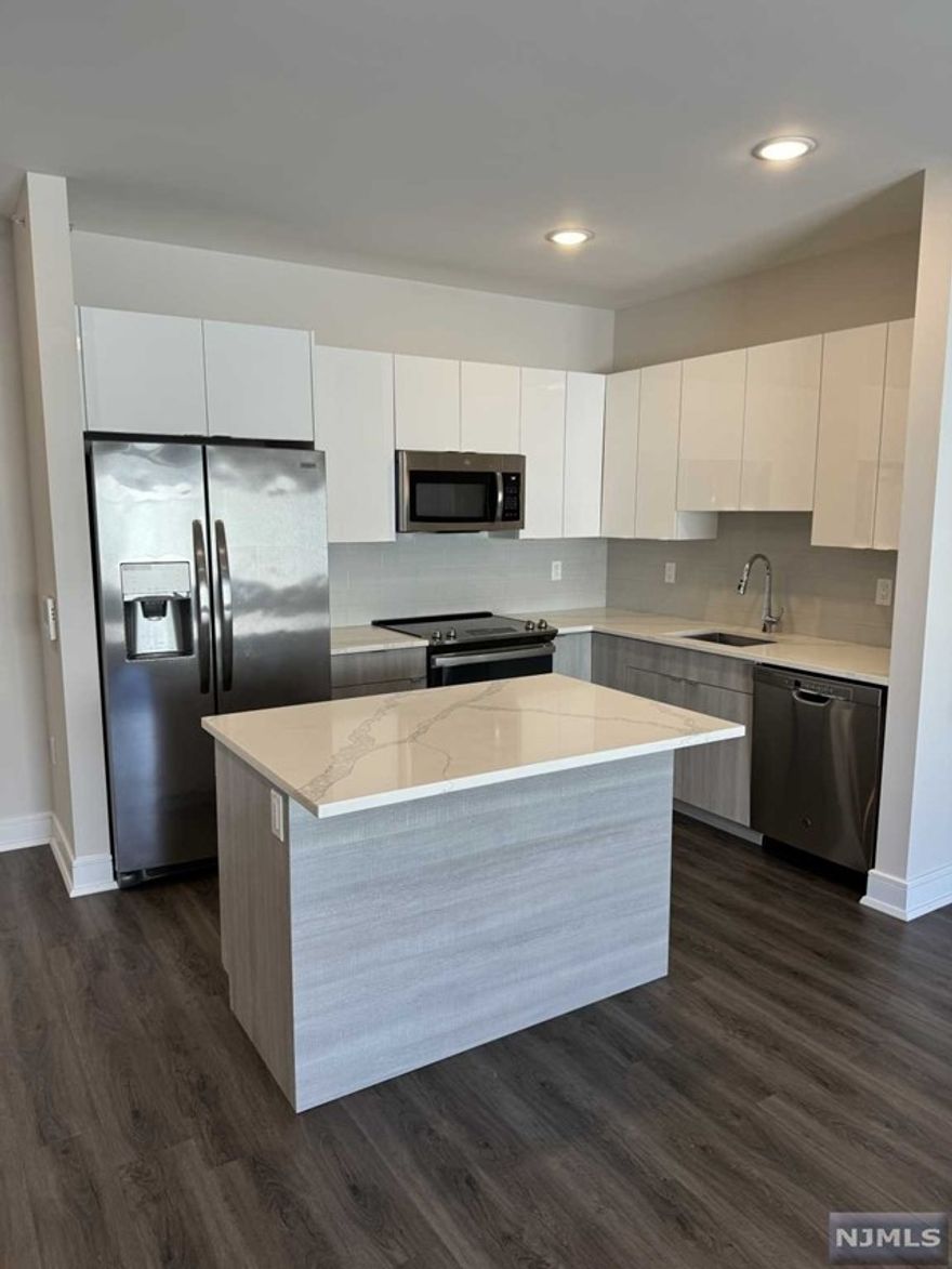 Welcome to the Metro, Fort Lee's newest luxury building. 1 parking space INCLUDED, and REDUCED security to qualified applicants - The Metro features a variety of upscale, spacious floorplans. high-end residences fully equipped w/ modern kitchens w/ stainless steel appliances, quartz countertops, full islands & tiled backsplashes, open living/dining areas, shades on all windows, modern bathrooms & a full-sized washer & dryer in each unit. The Metro features a large elegant lobby, outdoor courtyard, outdoor terrace/garden, large club room and a on-site fitness center, which includes the Echelon Reflect mirror , electric car charging stations & INDOOR (covered) parking garage w/ direct elevator access to all residences for uncompromising security. Pet friendly ! (LB limit & fees apply) Tenants pay utilities. All amenities & one garage parking space is included.