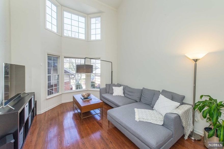 Beautifully appointed 3BR, 2.1B townhome w attached 2 car garage located in desirable Roseland Glen. First floor primary suite w vaulted ceiling & custom WICs. Large EIK with newer S/S appliances (2016), wood cabinetry and tiled floor. Bright & airy LR w vaulted ceiling, bay windows and skylights. Double-exposed gas FP between DR and LR. Second floor bath renovation(2016) w Italian tile, Toto toilet, skylight, cast iron shower base. Partially finished basement w large storage area, second refrigerator & laundry room. First floor HVAC unit replaced in 2018, Second floor AC condenser in 2022, water heater in 2022. W&D replaced in 2016. New roof in 2022 - special assessment of $240 monthly for project through 10/23. New skylights in LR, Den, Main & Primary Baths. Ecobee thermostats. Hardwood, laminate, and tile throughout. Conveniently located near NYC transportation. Great schools, shopping and major highways nearby! Security cameras in home.