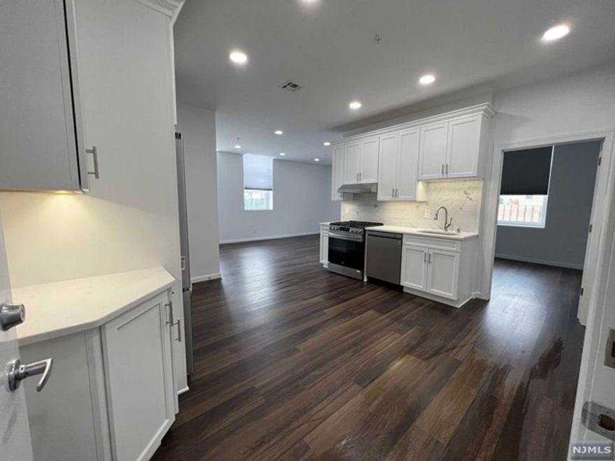 Gorgeous, modern, NEW CONSTRUCTION apartment just built and NEVER LIVED IN! Spacious, light & bright open floor plan with oversized windows that let in lots of natural light. Quartz counters in kitchen with plenty of cabinet space including pantry-all with soft close hinges, under-cabinet lighting, space for floating island, plus high-end print-proof stainless appliances including dishwasher with third rack, convection oven with air fry and griddle, and French door fridge with ice maker. Full bath features marble counters, soft close vanity, medicine cabinet, pantry closet and shower over tub. Plenty of closets throughout including double closets in bedroom. Room darkening shades in BR. Use of garage parking for no extra fee! Plus, convenient laundry on-site & 24HR security cameras for your peace of mind. Close proximity to shopping, NYC bus & train station, schools and parks! NO pets/NO smoking. Credit/background check required. Tenant pays gas and electric, Landlord pays water.