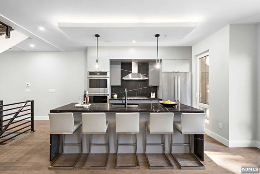 LAST UNIT REMAINING!!!! INTRODUCING A UNIQUE COLLECTION OF 8 DESIGNER TOWNHOMES....DEVELOPED BY PREMIER DEVELOPERS AND DESIGNED BY VDA DESIGN, ALL UNITS FEATURE GOURMET KITCHENS WITH QUARTZ COUNTERTOPS AND STAINLESS STEEL APPLIANCE PACKAGE, OPEN LIVING ROOM/DINING ROOM WITH FIREPLACE, AND POWDER ROOM..PRIMARY SUITE COMPLETE WITH SPA-LIKE MASTER BATHROOM, SECOND BEDROOM AND THRID BEDROOM WITH HALLWAY BATHROOM...ROOF TOP TERRACES WITH FINISHED LOFTS...FINISHED GROUND LEVEL OFFERS RECREATION ROOM, HALF BATH, AND TWO CAR GARAGE...ADDITIONAL FEATURES INCLUDE RECESSED LED LIGHTING, OAK HARDWOOD FLOORS, HIGH EFFICIENCY BOILER, MULTIZONE HEATINGS AND COOLING.