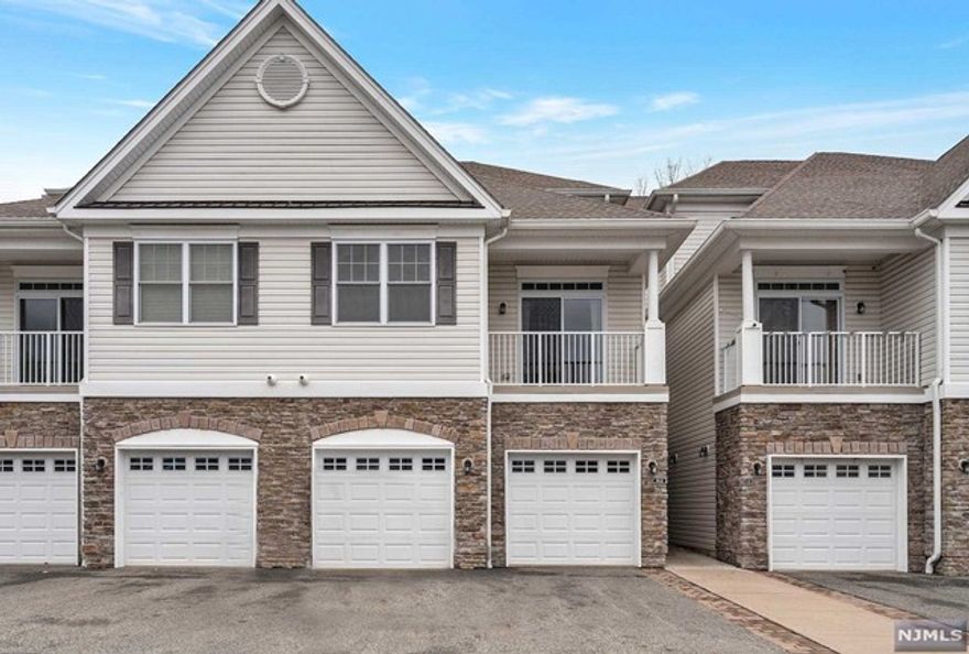 Immaculate 2016-built townhome in Lakeland Village. Spacious 1,680 sqft. interior with gleaming hardwood floors, high ceilings, and neutral color palettes throughout. On the 1st level is a bright, open floor plan featuring a modern kitchen with granite countertops, stainless steel appliances, and a center island/breakfast bar that opens to the designated dining and living spaces with beautiful vaulted ceilings, tall windows, and glass doors to a balcony that is perfect for entertaining. Upstairs features newer laminate flooring and a huge loft overlooking the 1st-floor living space that can function as a home office, playroom, or living room. Sizable primary bedroom with full bath, tray ceiling, and a walk-in closet. An additional bedroom, full hallway bath, and conveniently located laundry room wrap up the 2nd level. Attached oversized garage with room for storage. Easy maintenance and in a great location - close to shopping, restaurants & easy access to NYC via major highways.