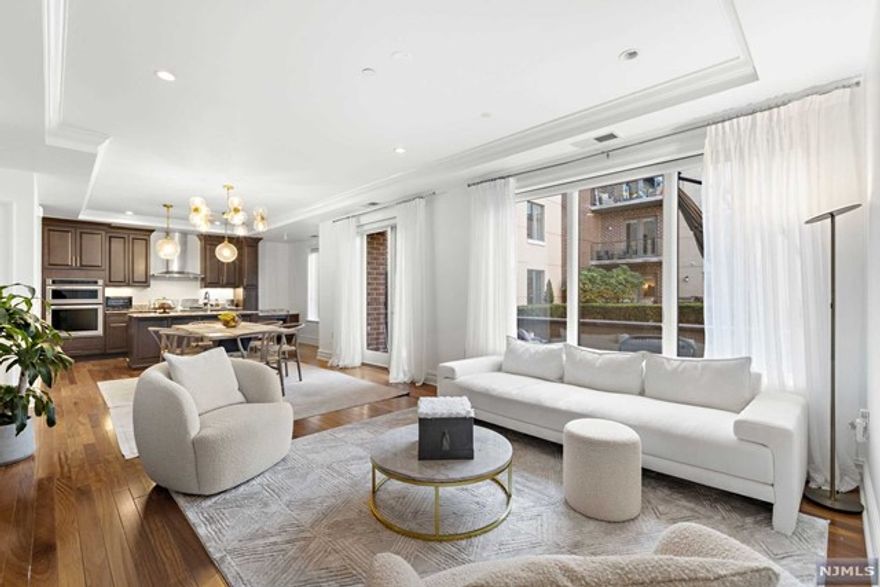 WELCOME TO YOUR DREAM HOME! Live on Cloud 9...Light Airy Bright Sunny Spacious Open Layout! NEW WOOD FLOORS & PAINT-1,064 SF interior + 280 SF Exterior Garden Patio! SOUTH FACING 1B +DEN/OFFICE + SUPER-SIZED GARDEN PATIO + STORAGE LOCKER + WALK-IN CLOSET + POWDER ROOM + LAUNDRY IN UNIT + 1 INDOOR PARKING SPACE + DREAM COMMUTE + PET FRIENDLY! Views of English Gardens/Courtyard from this fabulous architectural wonder! Crown moldings, soffits, recessed lighting thruout! Stainless Steel appliances, Marble spa w/ glass enclosed separate shower & deep soaking tub! Full-size laundry in unit, 1 in building garage space, 8x4 storage unit to boot! Dream commute to NYC via NY WATERWAY FERRY (FREE SHUTTLE ONSITE), HUDSON LIGHTRAIL to PATH/NY MTA, or NJ TRANSIT BUS 158 to LINCOLN TUNNEL or GWB in a NY MINUTE! Port Imperial Hudson Riverwalk + DOG RUNS + Weehawken track & ballfield! Come & see before this goes! Amenities-CONCIERGE, OUTDOOR POOL, PLAYROOM, GYM,Yoga,Event,Cinema Rooms, Firepit, BB