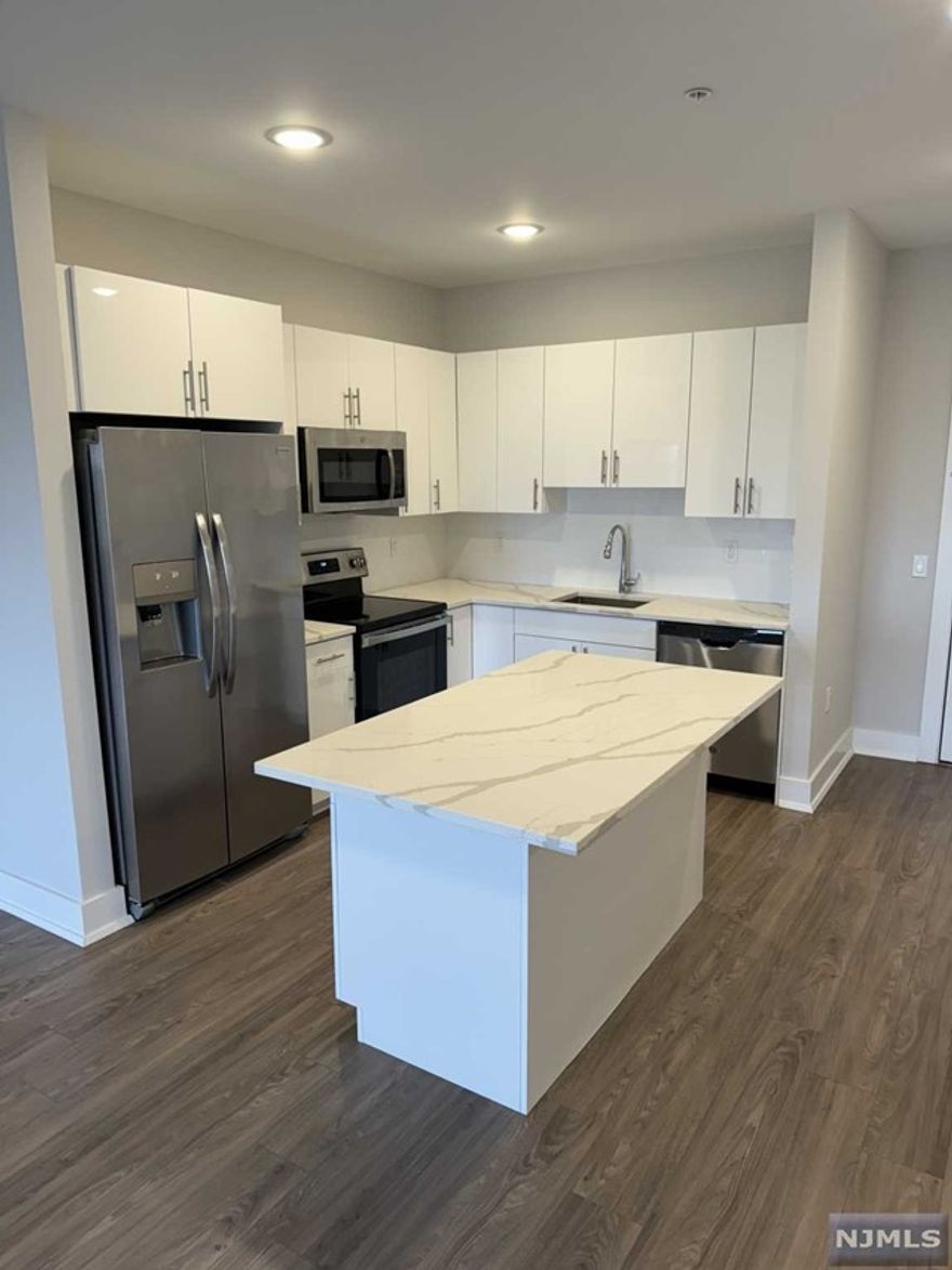 1 parking space INCLUDED, and REDUCED security to qualified applicants - Welcome to The Addison - Fort Lee's new luxury rental building offering a variety of upscale, spacious floorplans. The Addison offers high-end residences fully equipped w/ modern kitchens w/ stainless steel appliances, quartz countertops, full islands & tiled backsplashes, open living/dining areas, shades on all windows, modern bathrooms & a full-sized washer & dryer in each unit. Exclusive 24/7 virtual doorman service for communications, package deliveries & access control via video intercom system linked to your smart phone. The Addison includes a large on-site fitness center including virtual touchscreen workout mirror, electric car charging stations & parking garage w/ direct elevator access to all residences for uncompromising security. Pet friendly ! (LB limit & fees apply) Tenants pay utilities. All amenities & one garage parking space is included.