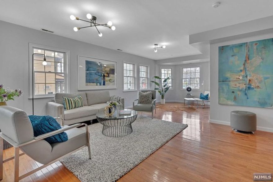 Perfectly located, nearly 1500 sq ft, spacious 3-bedroom, 2 full bath unit in the heart of Weehawken Heights with parking! Currently being used as 2 bedrooms plus den and additional home office. As you enter the foyer it will lead you into the large open concept south facing Living Room drenched with natural light which is perfect for entertaining.Sitting area with bay window easily converted to 3rd bedroom. Fully equipped kitchen with dining area complete with Stainless Steel Appliances, plenty of counter space for all your cooking needs, and a Walk-In Pantry for extra storage. The oversized main bedroom, with a walk-in closet and a Master ensuite Bath with Tub, Shower and Bidet. The second bedroom also has hardwood flooring with generous closet space and the Main Bath includes a jacuzzi jetted tub with stand-up Shower. An additional bonus room perfect for an office space completes this unit. Front porch and front brick paved common yard space!