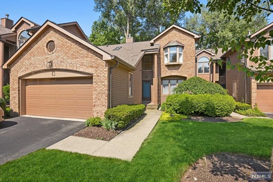 Welcome to this lovely 4 bed 3 full, 2 half bath townhouse. You'll be impressed with your first floor offering of a formal dining room, eat-in kitchen, a very spacious living room with tons of light courtesy of windows, and a first floor master suite. A powder room and beautiful hardwood floors complete the common living space. Ascend to the second floor, where you'll find two more bedrooms and a full bathroom. Descend to the lower level where you'll find a spacious recreation room, office, and fourth bedroom with a full bath and sliders that walk out into the very private backyard.