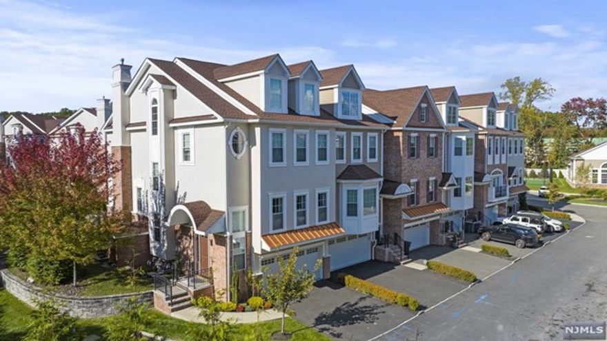 ONLY CORNER UNIT AVAILABLE in the highly coveted gated community, The Alexa. 206 Brandon Ct sits at the end of a cul-de-sac and features upgrades throughout the unit including PRIVATE ELEVATOR. Two Story foyer w MDF custom millwork, 10' ceilings on Main Level w custom moldings throughout, Open Living Room/Dining Room, Butlers Pantry, Gourmet Eat In Kitchen w Quartz Counters and SubZero Refrigerator, Viking Range, Bosch Dishwasher and Microwave, Sitting Area w Gas Fireplace, and deck w stairs leading down to common area. Primary Suite w double door entry, tray ceiling, custom walk in closets, sitting room, and en-suite Bath w freestanding soaking tub, double vanity, and glass enclosed shower. Additional two bedrooms share hallway bathroom offering double vanity and tub. Finished Bonus Loft w private bath perfect for a study, playroom, or guest suite. Ground Level offers 2 car garage, finished tiled recreation room with radiant heat, wet bar, and full bathroom