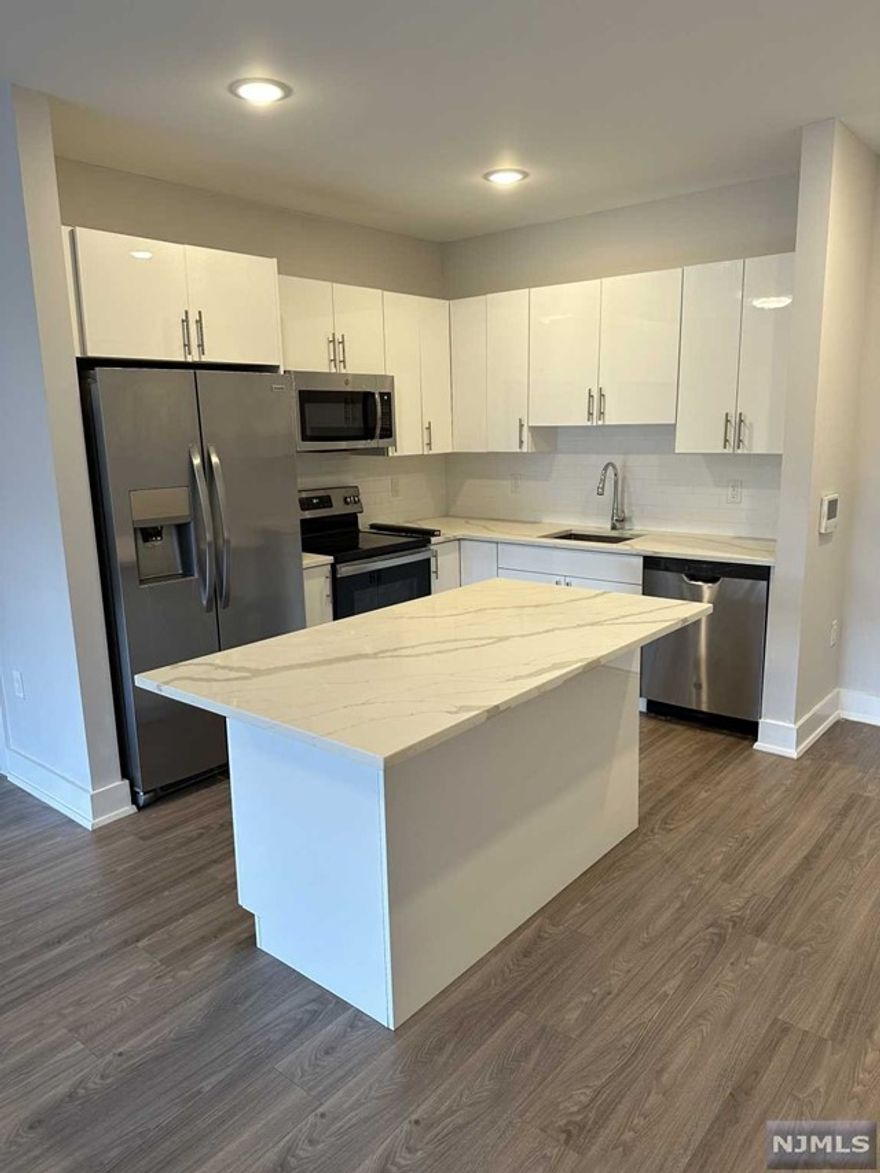 1 parking space INCLUDED, and REDUCED security to qualified applicants - Welcome to The Addison - Fort Lee's new luxury rental building offering a variety of upscale, spacious floorplans. The Addison offers high-end residences fully equipped w/ modern kitchens w/ stainless steel appliances, quartz countertops, full islands & tiled backsplashes, open living/dining areas, shades on all windows, modern bathrooms & a full-sized washer & dryer in each unit. Exclusive 24/7 virtual doorman service for communications, package deliveries & access control via video intercom system linked to your smart phone. The Addison includes a large on-site fitness center including virtual touchscreen workout mirror, electric car charging stations & parking garage w/ direct elevator access to all residences for uncompromising security. Pet friendly ! (LB limit & fees apply) Tenants pay utilities. All amenities & one garage parking space is included.