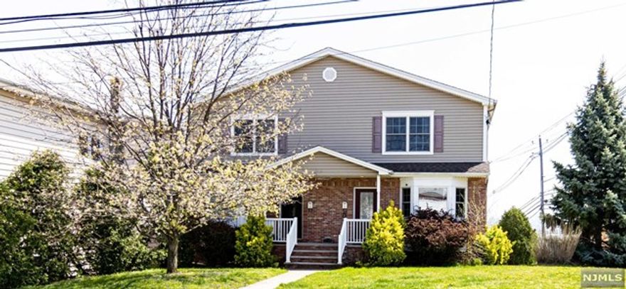 SIDE BY SIDE DUPLEX LOCATED ON CORNER OF HACKENSACK ST AND UNION AVE. 2 CAR GARAGE AND OUTSIDE PARKING SPACES ON BACKSIDE ENTRANCE ON UNION AVE. FINISHED BASEMENT WITH LAUNDRY. ALL BEDROOMS ARE VERY SPACIOUS. OPEN FLOOR PLAN. ALL HARDWOOD FLOOR, CENTRAL AIR. CLOSE TO WOOD RIDGE TRAIN STATION AND NYC BUS STOP.
