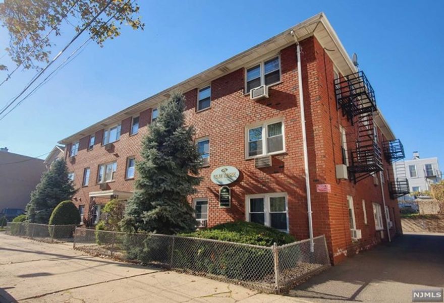 Beautifully renovated corner unit condo features hardwood floors throughout, spacious open floor plan flows from kitchen through dining room to a sunny living room, newer bright bathroom, large master bedroom and a good size 2nd bedroom. Very low maintenance fee includes water, heat, hot water, all indoor and outdoor common areas and snow removal. Laundry room on premises and an off-street parking in the back of the building is available for an additional fee. The building is pet friendly, located just across from charming Arlington Depot Park and close to stores, restaurants, NYC transportation via bus to Harrison Path train and NJ major highways.