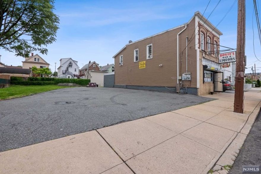 Amazing mixed used property with endless potential for developer/investor or new owner to run a profitable business. Package includes 2 lots, building,vacant lot and liquor license. Commercial property includes profitable liquor store/bar. Utility room with laundry area, bathroom, den used for storage. Full unfinished basement for additional storage space. Two detached car garage part of the rental income. Separate entrance to second floor rental apartment with 3 bedrooms, eat-in-kitchen, full bath, living/dining room. In addition, property #146 lot (multi family zoned), liquor inventory paid at closing. Plenty of off street parking. Tremendous expansion potential. Owner is willing to train people who will manage the business.