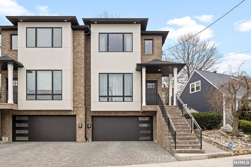 Welcome to 403 Northwood! A one-year young OVERSIZED townhome in the heart of Bergen County and a highly rated school district. This custom home boasts all the extra features you're looking for, while being steps away from NYC Transportation. 10ft Ceilings, exquisite tile design, and Viking Appliances gives this house the luxury feel we want. The open floor plan and custom trimwork makes this home a must see. Schedule your private tour today!