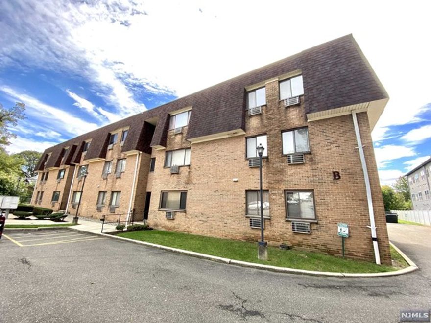 Welcome to Brandywine Condominiums! Assigned parking directly in front of unit with secured locked entryway. This ground level, move-in ready unit features one level living. This spacious carpeted 2 bedroom with recently renovated bath also features vinyl flooring throughout main living area. Multiple closets along with additional storage unit located in basement equipped with private laundry (washer/dryer included). This complex is conveniently located near shops, restaurants, and has close access to NJ/NY Public Transportation. Close to major highways, golf courses, and schools. This unit offers great community living! PARKING SPACE #24 with option to rent another for a monthly fee.