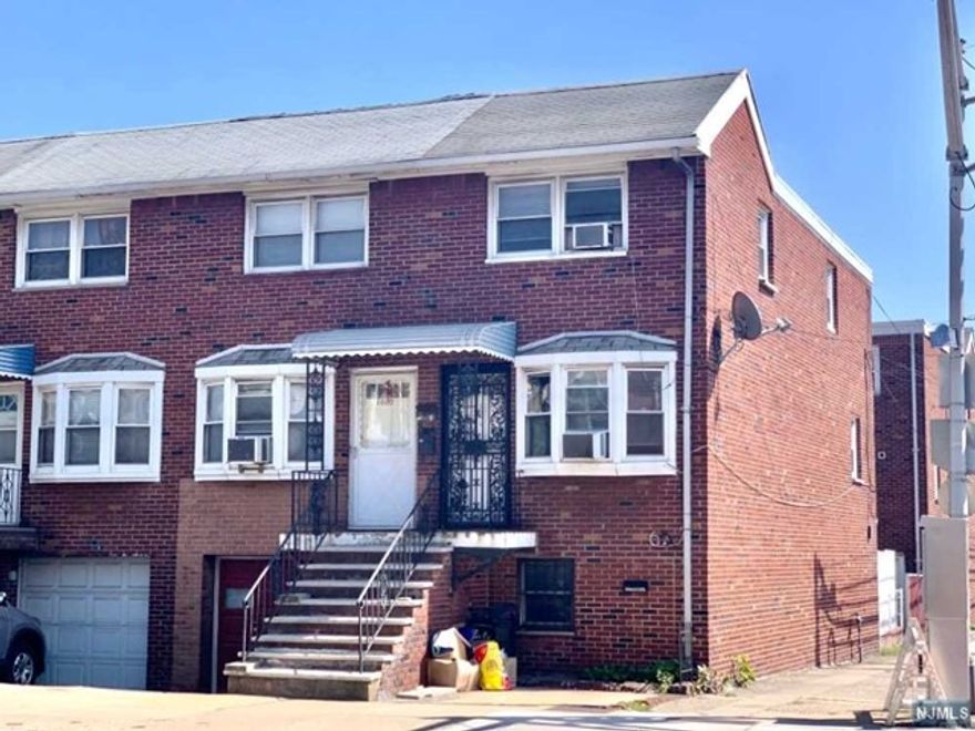 End unit row house built in 1963. First Floor & 2nd floor for rent. Ground floor and backyard excluded. Tenant has an option to use the washer & clotheslines on the ground floor. One parking space included for a small car. Available to occupy in a few days. Refrigerator & 3 window A/Cs supplied. No smoking in the apartment & No pets. Good credit required. Tenant is responsible for removing the snow from the sidewalk, front steps and the parking space after it snows. Tenant pays all utilities including water & sewer. Laminated floors throughout. Good sized rooms. Living/Dining Room: 26'x10'11, 2 Bedrooms: 13'6x10'11, 15'3x10'11, Kitchen: 11'x12'9. Short walk to Harrison Path Station. Close to Newark Light Rail, NJIT, Rutgers, NJPAC, and Prudential Center. Convenient to Turnpike, Parkway, Rt. 280 & Rt. 21. One-month Broker's Commission to be split between the Landlord and the Tenant. Each pays a half.