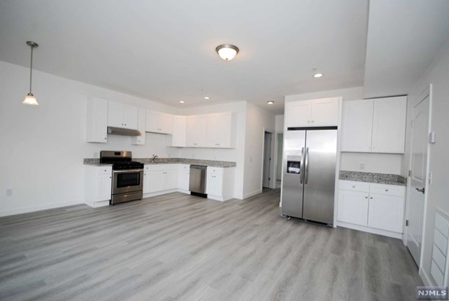 Welcome home to this beautifully updated 2 bedroom, 2 bathroom apartment...Stainless Steel appliances, hardwood floors, recessed lighting, Central A/C, Washer & Dryer in unit, 2 assigned parking spaces. A commuters delight!