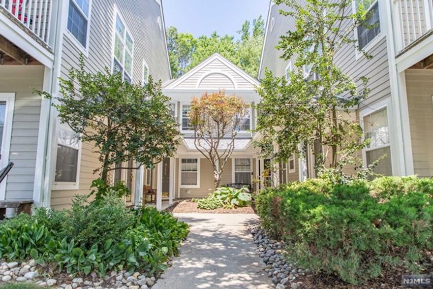 Welcome to this desirable end unit in Paddington Square! South facing for tons of great natural light, this two bedroom two full bath features an updated kitchen with SS appliances and granite countertops. Main living level also features a huge bedroom, with a walk-in closet, full bathroom with tub and brand new tile flooring, and living room/dining area with soaring vaulted ceilings! Sliding glass doors off of the living room lead to your own private deck. Upstairs features main bedroom with large walk-in closet and updated en-suite bathroom with brand new vanity. Central air! Newer HVAC unit and newer laundry units. Enjoy the beautifully manicured grounds featuring walking trails, a pool and a playground! Not to be missed!