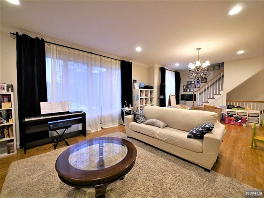 Discover the epitome of suburban sophistication with this exquisite Jr 4 bedroom townhouse, perfectly positioned in the heart of Fort Lee. This stunning home is a rare gem that offers both privacy and proximity to the area's finest amenities. Step inside to find a spacious and inviting living room that boasts an open-plan design, ideal for entertaining and everyday living. The modern kitchen, complete with stainless steel appliances and elegant cabinetry, providing the perfect setting for culinary exploration. Upstairs, the three bedrooms offer a tranquil escape with generous windows that usher in natural light. The master suite is a true sanctuary, featuring a luxurious en-suite bathroom and abundant closets. This townhouse is a haven for those seeking a balance of serenity and urban convenience. Located within walking distance to Linwood Plaza, highly-rated school School 3 and steps to NYC bus, it promises a lifestyle of ease and accessibility.