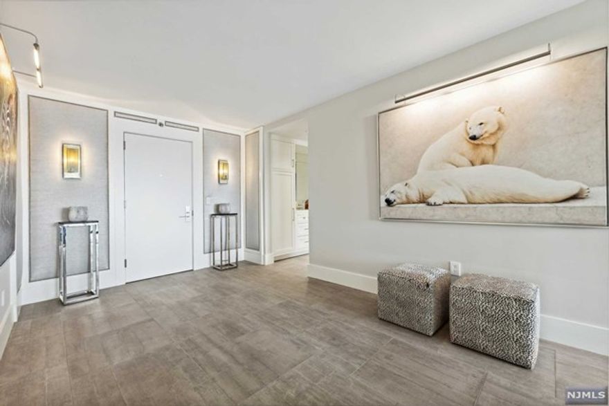 Rarely do you ever see such a magnificent & pristine apartment enter the market. Breathtaking river views from the 19th floor, this gut renovated apt. has it all: Custom oversized windows plus ceiling to floor glass sliders to an open 22-ft by 7-ft waterfront balcony. Two expanded en-suite bedrooms, 8' floor moldings sit atop seamless rectified stone floors. Masterfully done architecturally built-in woodwork throughout. Kitchen has 3' thick marble countertops w/single slab marble walls, Sub Zero & Bosch appliances plus full size oven with induction cooktop. Fixtures throughout bathrooms are Waterworks & both have large marble showers w/built-in benches. Huge walk in closets, laundry in unit, built-in safe on steel beam in closet, 4 zones of HVAC, personal security system & Kangen built-in purified water system. Hardware thru out the apartment is Baldwin polished nickel. Parking is $115 per spot. Homeowner has NJ Realestate License.