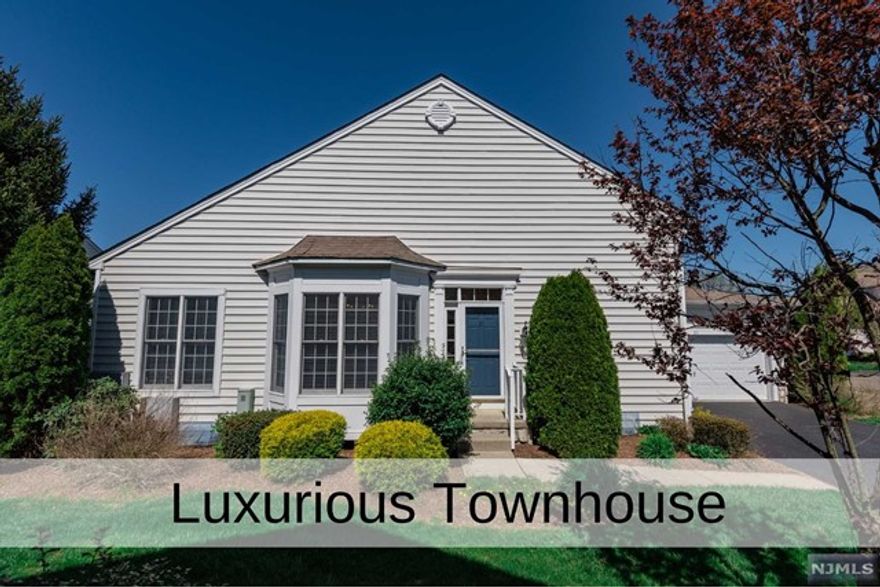 Elegant Deerfield Model Townhouse in the sought after upscale Brettonwoods community. This sunny and bright home offers a versatile floor plan w/ gleaming hardwood floors throughout. The first floor offers an elegant Living Room, spacious Formal Dining Room w/ detailed molding, Den w/ fireplace, Modern Eat in Kitchen with Stainless Steel Appliances, Cherry Cabinets w/Granite Countertops and a cozy breakfast nook. Large Deck off of kitchen w/ Sliding Door is perfect for morning coffee. The Primary Bathroom w/ ensuite Full Bath w/ Jacuzzi Tub and Stall Shower conveniently located with providing easy access. The second floor offers 2 additional Bedrooms each having it's own bathroom, a Loft area with Office/Family Room. The Finished Basement is complete w/ Rec Room w/ high ceilings, bedroom/den/office, Full Bath and Storage/Utility room. Central Vacuum, 3-Zone Heat and A/C, 2 Car Garage. Conveniently located to Golf Course, Schools, NYC Bus, Parks, Houses of Worship and Shopping.