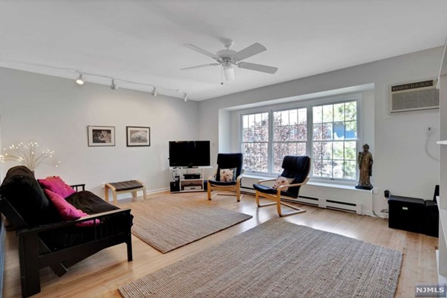 Sunny and spacious two-bedroom 2nd floor corner unit near Montclair's vibrant Downtown area featuring shopping, restaurants, theatres and NYC transportation. The complex is nestled in off the main street and is surrounded by mature plantings. There is a new vinyl fence for privacy in the backyard near the patio. The unit is on the quiet side of the complex away from Claremont Avenue and faces west and north. The location is ideal for working from home or just enjoying a relaxing cup of coffee while listening to the birds at the backyard feeder. And having two exposures makes for a fabulously sunny space to enjoy during the day. There is convenient access to the patio, the garage, laundry room and storage area. Freshly painted in neutral colors. New bamboo floors. New stainless dishwasher. Garage has extra storage plus there is a locked storage area in the laundry room. Two cats are permitted. Low monthly maintenance of $225 includes water, sewer, snow removal plus exterior/common