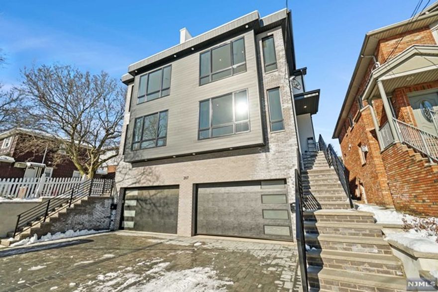 Welcome to 207 4th St, a RARE High End Duplex with Private Rooftop built by one of Gold Coast's Top Builders, MM Bergen Developers. This new construction home features 4 bedrooms, 3 full bath and 1 half bath. First floor's open layout offers a kitchen with Bosch Stainless Steel appliances, quartz counters / backsplash & oversized waterfall island, professionally designed powder room, LR and DR with custom shelving and cabinetry throughout, baseboard heating, wide white oak floors, speakers and direct access to backyard off kitchen. Second floor offers 2 vaulted ceiling bedrooms, full bath, laundry rm, Master Bedroom with walk in closets and Master Bath w/ oversized rainfall shower, soaking tub and heated floors. Third floor offers private roof top with tree lined views. Completing your home, the ground level offers large Rec Rm with wet bar, Bedroom, Full Bath and oversized garage tall enough for 2 car lifts