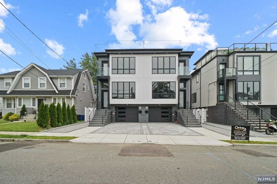 Stunning brand new 4-level luxury duplex with a rooftop terrace and NYC views in the most desirable East Palisade section of Cliffside Park. This home is sure to impress as it offers a perfect blend of contemporary design and comfortable living. Ideally situated close to public transportation and schools. Curb appeal, black brick exterior and stucco facade with Grand Anderson windows throughout. The 1st level has a spacious garage, Main level has an open concept with an abundance of natural light, 9 ft ceilings, dining area, living rm with fireplace and a half-bath. The gourmet kitchen includes stainless steel appliances, quartz countertops with an oversized island leading to a large balcony deck. The 3rd level boasts a primary suite with double closets and a spa-like bathroom. Laundry in the hallway alongside 2 bdrms and a full bathroom. The 4th level has 1/2 bath, wet bar and rooftop. Owner is a licensed RE agent.