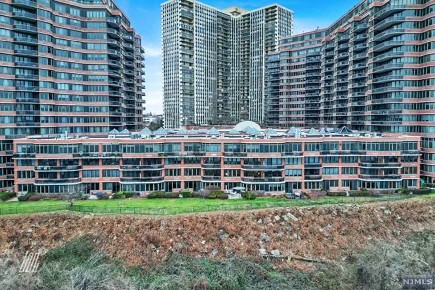 Nestled in the full-service building of Carlyle Towers, this 3BR/3.1BA, 2,500+sqft residence boldly embodies the urban aesthetic, while seamlessly incorporating classic design elements. Elegantly enriched with soft natural light, the 1st floor features stunning hardwood floors, an open layout, high ceilings w/custom lighting, powder room, spacious living room w/fireplace (wood & electric), patio, and a gourmet kitchen with premium stainless-steel appliances, European-inspired cabinets, and a breakfast bar peninsula. Designed for relaxation, the main primary bedroom captivates with a private balcony boasting Hudson River/NYC views, tons of closet space, and an uber-luxe en suite with a soaking tub, dual sinks, and a separate shower. 2 bedrooms each have a private en suite. Other considerations include n kids playroom, private storage, fitness, party/meeting room, outdoor pool, 24-hr doorman, add'l parking w/ a fee, valet parking, and more!