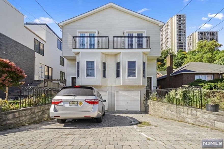 Newly renovated townhouse on the best block in Edgewater. Flooded with natural light, this east-facing townhouse is a gem. Enter thru the living room, open floor plan dining area, and brand new kitchen with SMART Stainless Steel appliances, Quart countertop, and access to backyard patio. Primary Bedroom opens to a balcony with views, ensuite bathroom with double vanity, shower stall, and bathtub. Proceed to 2 more bedrooms, a full bathroom, and a washer/ dryer on the same level. The Full finished basement offers a family room, 4th bedroom, and full bathroom. Myrtle Ave is a dead-end street just walking distance to River Rd and NYC transportation Listed on MLS 22039020 as well