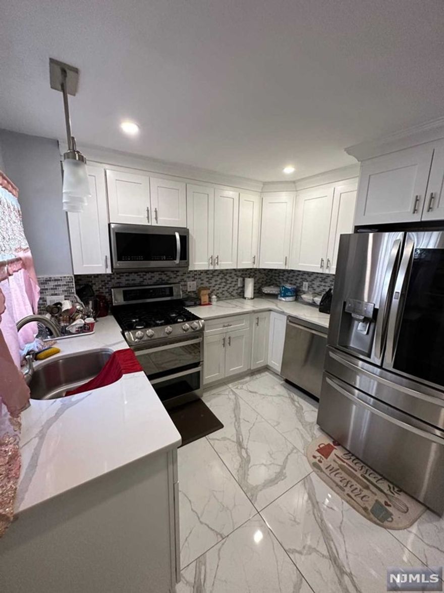 Renovated 1st Floor apartment in Paterson close to all transportation. 3 bedroom, 1 bath, modern kitchen apartment with dishwasher and modern huge refrigerator. Includes cold water, 1 parking spot and will have access to coin-operated laundry in the basement. No pets allowed. Tenant pays electric and gas. 2 1/2 month deposit to Landlord and 1 month Real Estate broker fee.