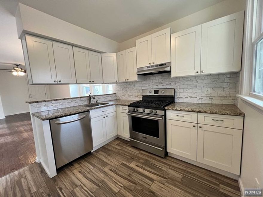 Updated first floor 2 bedroom 1 bath apartment on Lincoln Ave in Hawthorne, NJ. Modern white kitchen with dishwasher, gas stove, and a new refridgerator to be installed before tenant moves in. Plenty of closet space throughout. Washer and dryer in basement.Two parking spaces included with rent. Basement storage available as well.