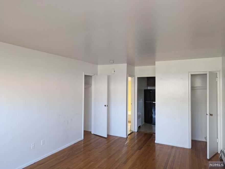 Renovated Studio Apartment. Heat & Hot water included. The tenant pays Broker's commission. Hardwood Floors Throughout the Apartment. Plenty of Closets and Amazing Sunlight. - BUILDING FEATURES - On site Laundry On site Parking Minutes to NYC by Car and Public Transportation Right There. Seconds from Shopping Areas Supermarkets. Steps Away from Nearby Kindergarten, Middle and High Schools. Clean & Well Maintained Building by On-Site Super. Great Safe and Diverse Neighborhood. Close to Ridgefield Park, Ridgefield, Teaneck, Bogota & Fort Lee. This is a first floor and parking included
